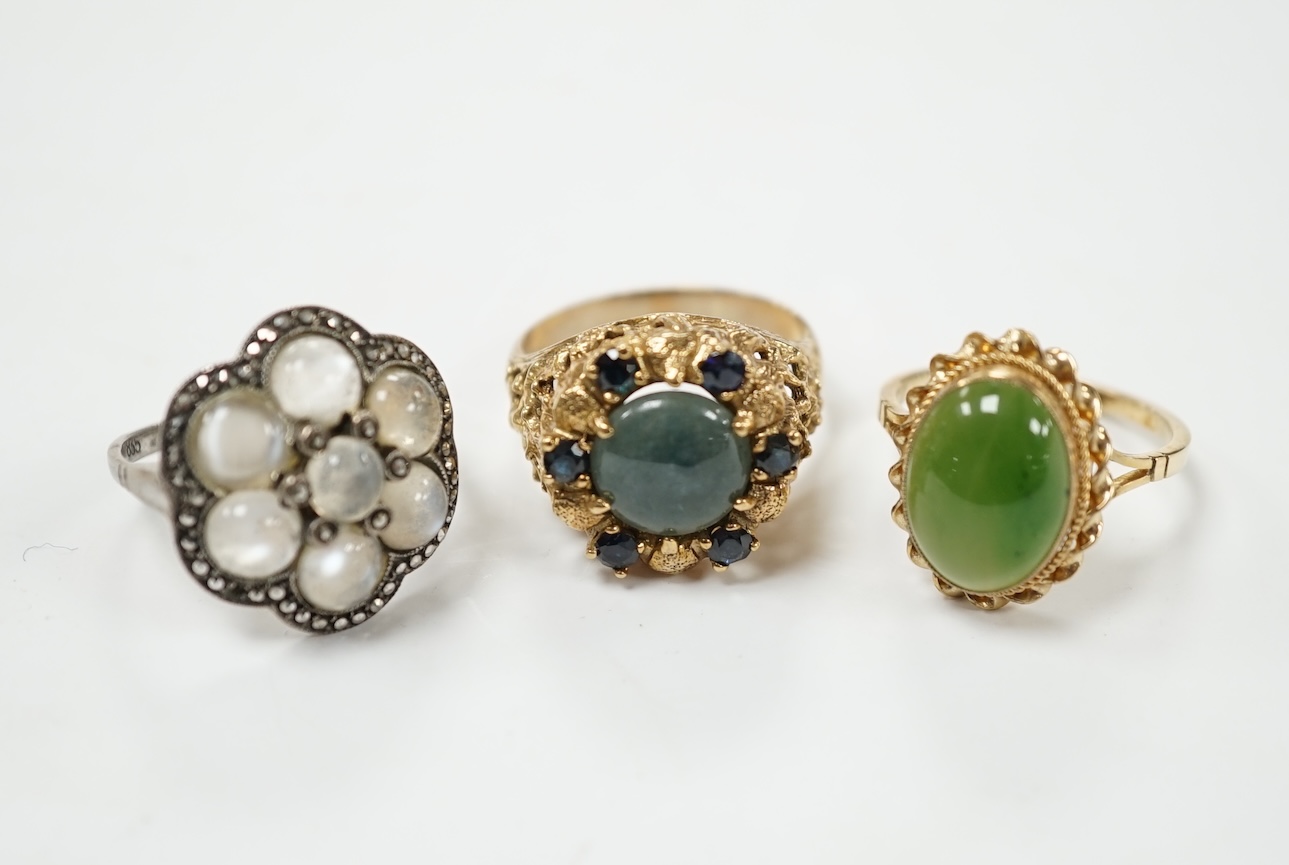 A 9ct gold and nephrite set ring, size P, one other 9ct and gem set ring and a German? Arts & Crafts 835, moonstone and marcasite cluster set ring. Condition - fair